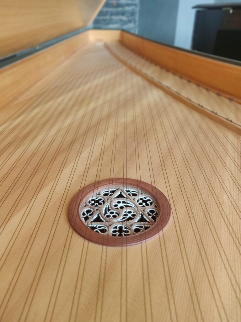 Inside a harpsichord 0 soundhole and strings