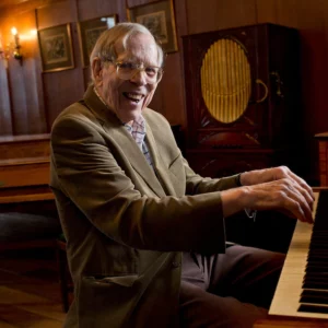 Richard Burnett sat at a piano in Finchcocks main hall