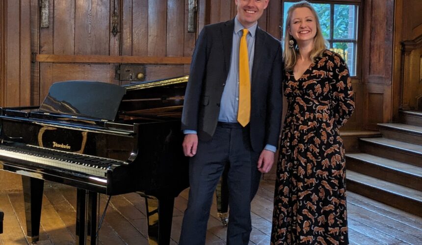 David Hall and Jennifer Maslin stand in Finchcocks main hall front right of the Bosendorfer smiling